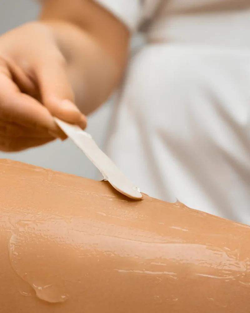 close-up-beautician-hand-applying-the-epilation-ge-2025-03-07-14-01-18-utc